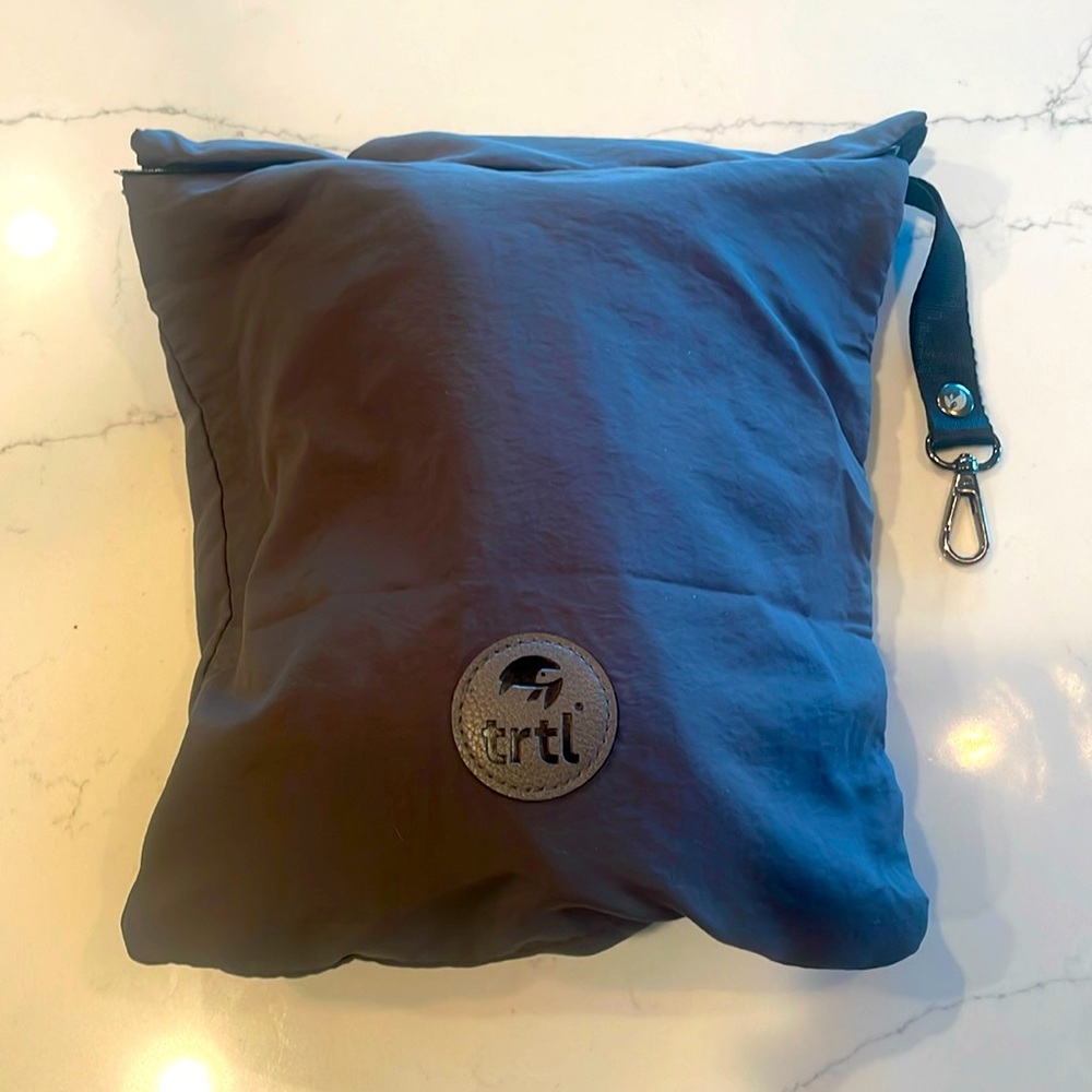 TRTL travel pillow with bag